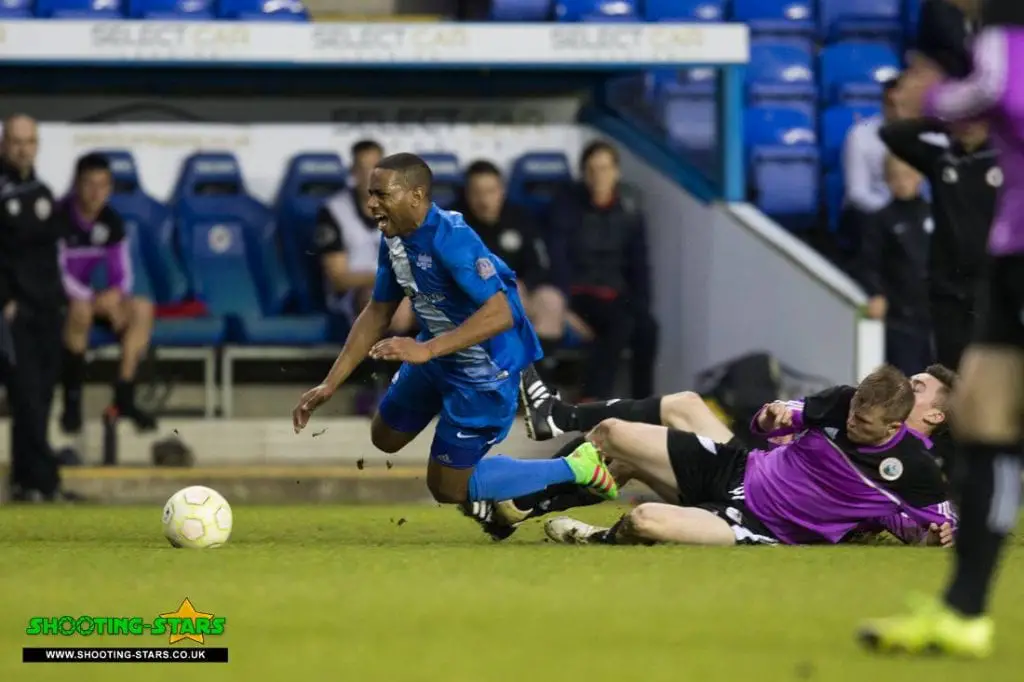 Jemel Johnson is fouled in the Reading Senior Cup Final. Photo: Rob Mack.