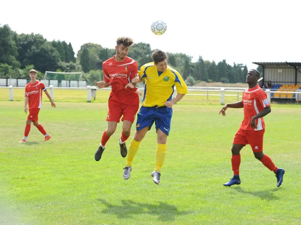 Ben Knight challenges in the air for Ascot United. Photo: Mark Pugh.