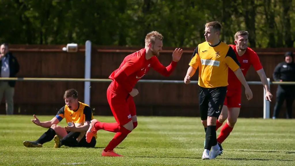 Josh Helmore wheels away after scoring for Binfield. Photo: Neil Graham / ngsportsphotography.com
