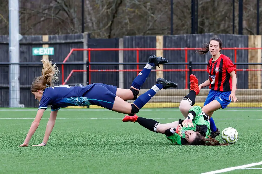Molly McKeever clashes with the Penn & Tylers goalkeeper as she's through on goal Photo: Oakmist Photography